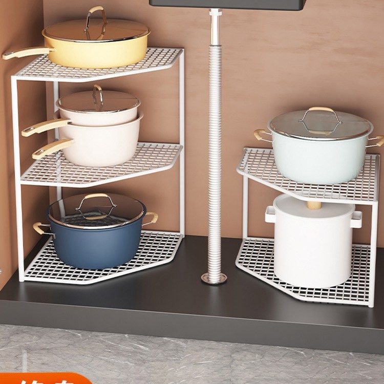 台所の棚のテーブルの角の鍋の収納棚の下の水槽の鍋棚の食器棚の中に鍋の階層棚の神器を入れます。|undefined