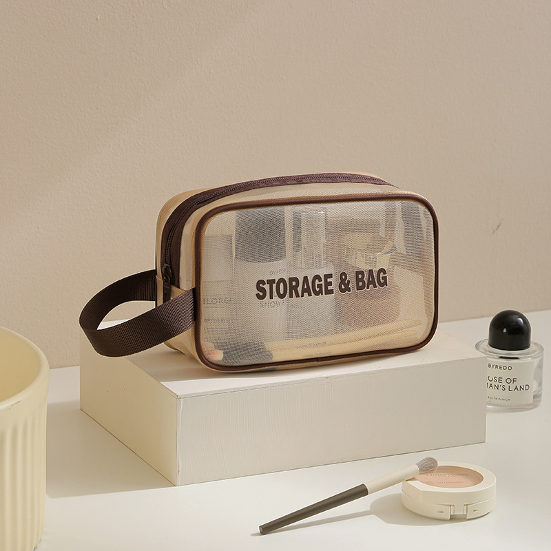 Bolsa de almacenamiento de lavado de hilo de red Bolsa de cosméticos de almacenamiento de viaje anti-salpicaduras Bolsa de almacenamiento de cosméticos de alto valor transpirable al por mayor