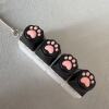 Four-button white shell - black silicone cat paw