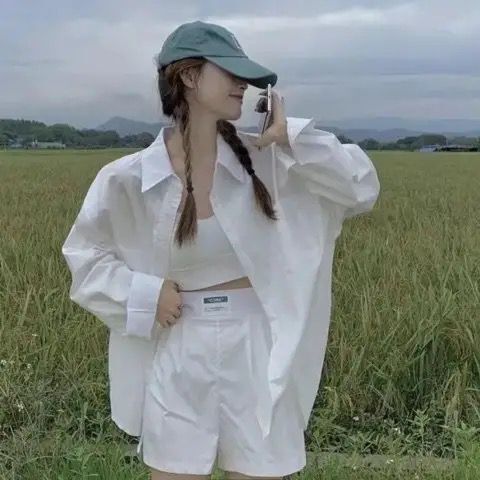 ピンクのPOLO襟の格子シャツのコートの婦人服の2024夏の新型の中の長い日焼け止めのシャツの長袖の上着の女性|undefined