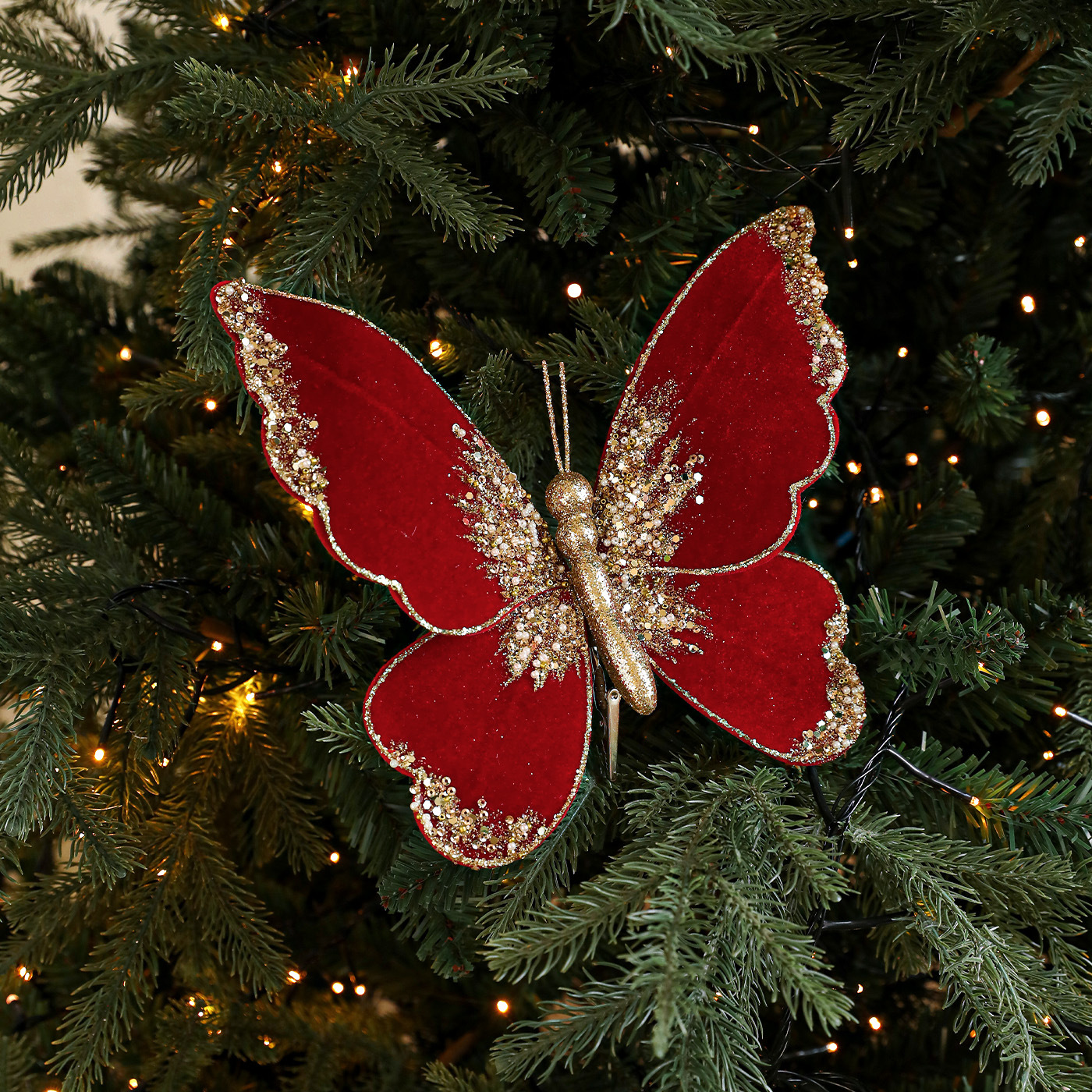 Nuevos productos de tela de alta calidad simulación de clip de arco de mariposa tela de vello polvo flocado árbol de Navidad decoración colgante diseño de escena