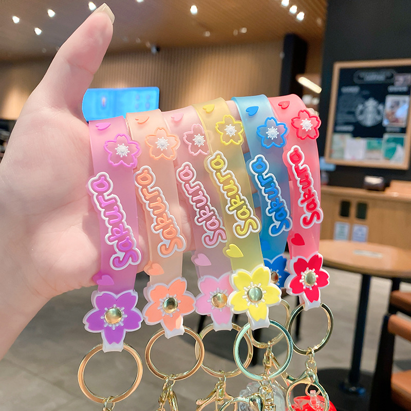 Llavero de rosa de aceite creativo lindo líquido arenas movedizas colgantes pequeños bolsos accesorios pareja pequeños regalos al por mayor