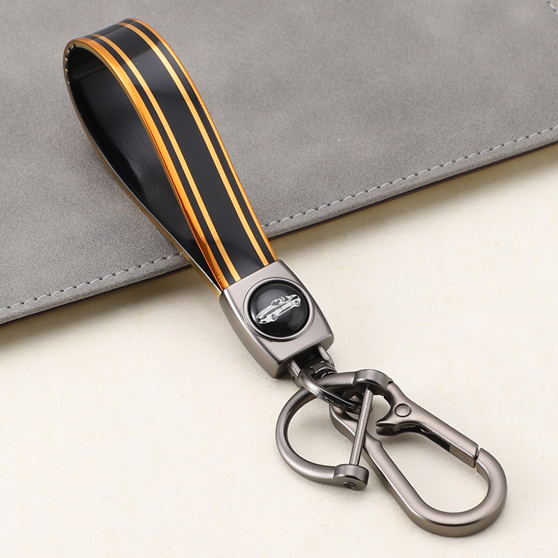 Cuerda de mano de silicona transfronteriza llavero de coche logotipo de coche apellido llavero anti-pérdida llavero de cuerda de mano de silicona duradera