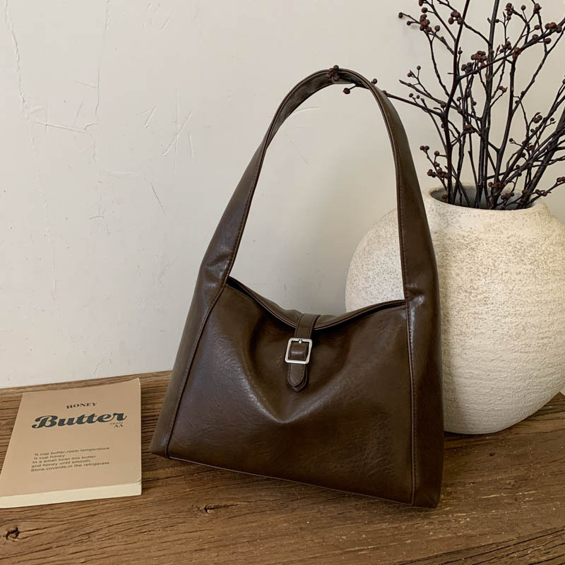 Luz de lujo retro cuero suave bolsas de brazo mujeres otoño / invierno 2025 nueva gran capacidad simple bolsas de hombro bolsas de mano