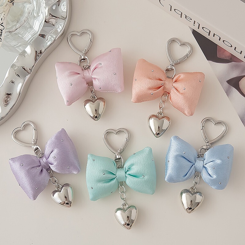 Trendy and exquisite butterfly-knot keychain, featuring a sweet heart-shaped pendant, perfect as a bag charm or a cute, unique heart-shaped keychain