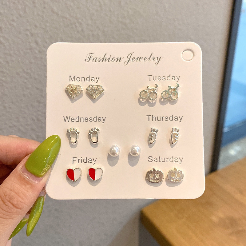 Pendientes de aro lisos para mujer, lujo ligero, pendientes de alta gama, pendientes populares, aretes de diseño exclusivo, aretes de otoño e invierno al por mayor