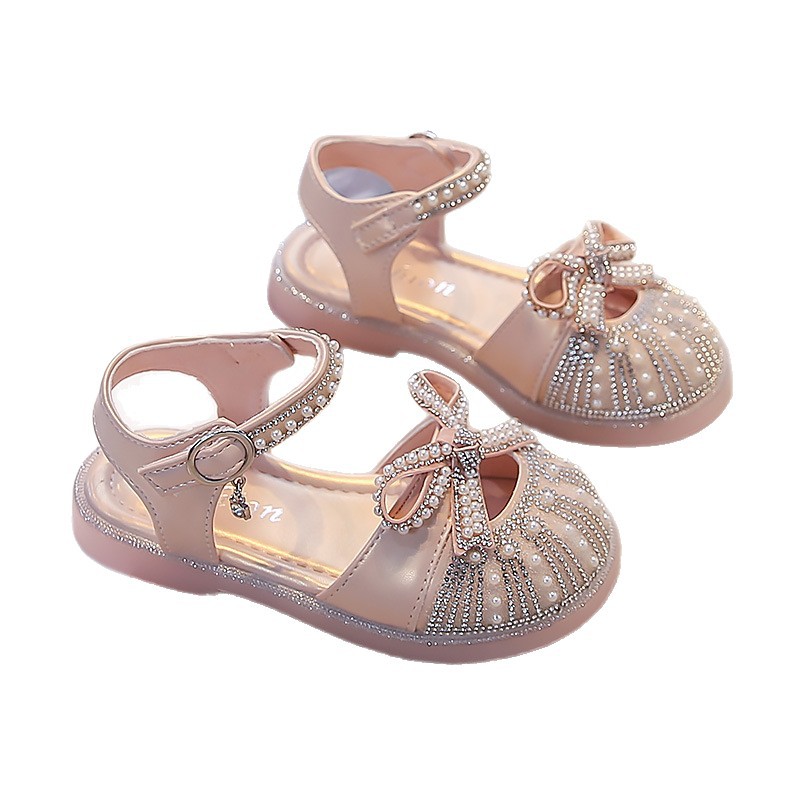 Sandálias de niñas verano 2026 nuevos zapatos de cristal para niños Feng Shui romanos zapatos de diamante para niñas zapatos de suela suave