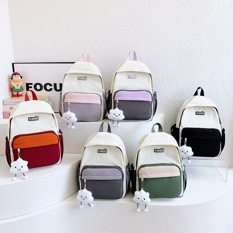 Mochila coreana ins-viento para niños y niñas, mochila casual simple de gran capacidad, mochila de color, mochila infantil, adorable colgante.