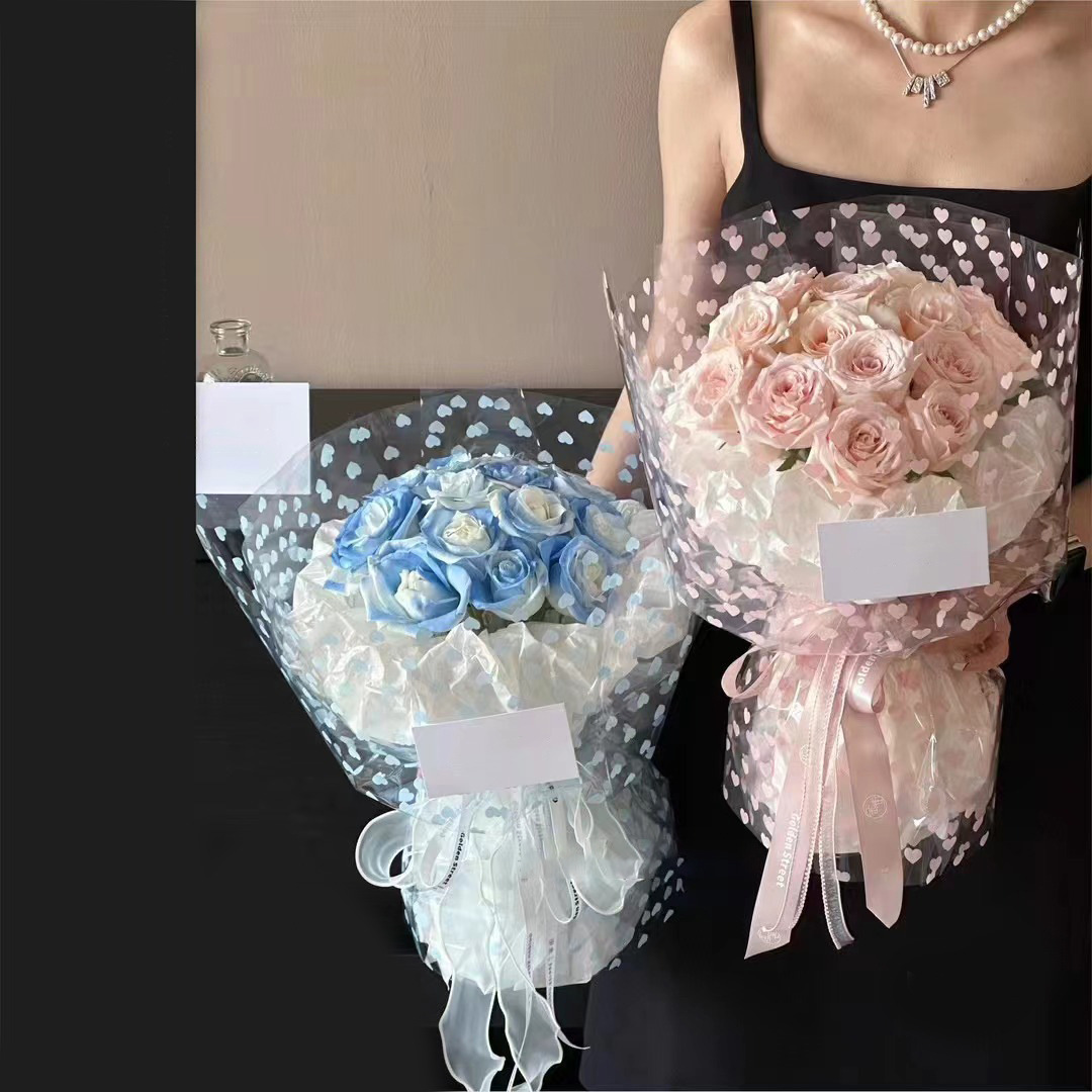 Fábrica de fiestas de flores al por mayor nuevos productos de impresión de amor de papel de vidrio flor de embalaje de flores transparente florista embalaje de papel