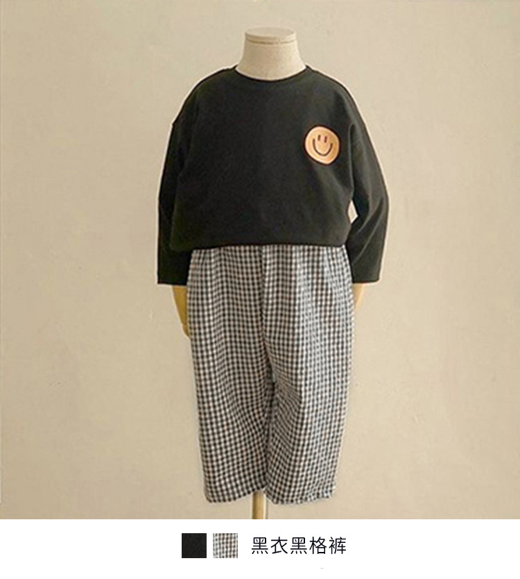 Black shirt and black checkered pants.jpg