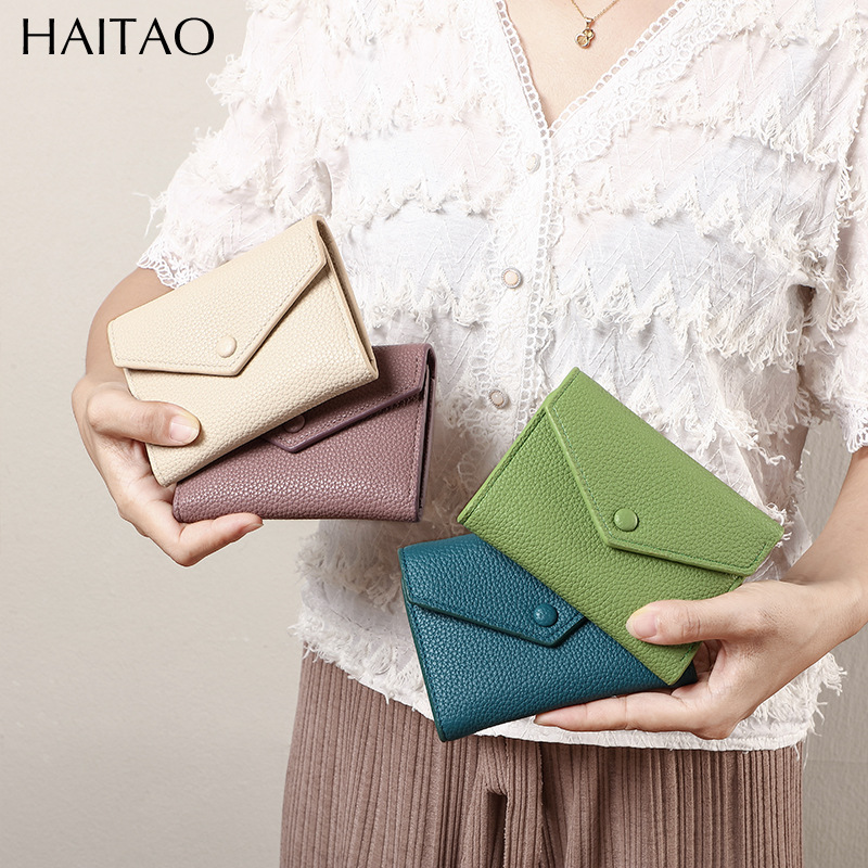 Cartera de mujer corta simple cartera plegable de tres pliegues japonesa y coreana de moda nuevo sobre bolso de cambio transfronterizo