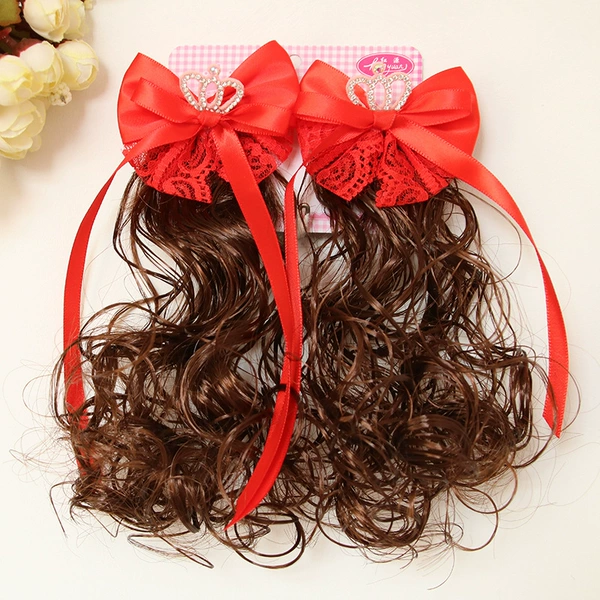 A pair of big red ribbons and crowns