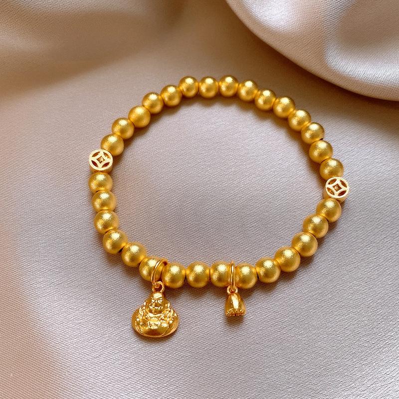 Pulsera-oro-estatua de Buda