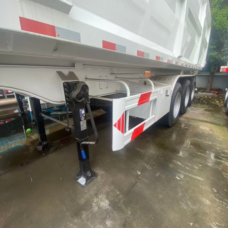 Rear-tipping self-unloading semi-trailer with front-mounted hydraulic cylinder, air-suspended single-tire lifting axle, sand and gravel transport vehicle, sourced from Central Asia