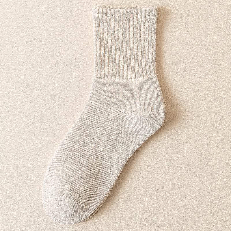 Calcetines de mujer de invierno forrado de lana gruesa caliente Terry Calcetines de piso de otoño e invierno de color sólido a media pantorrilla Zhuji calcetines al por mayor