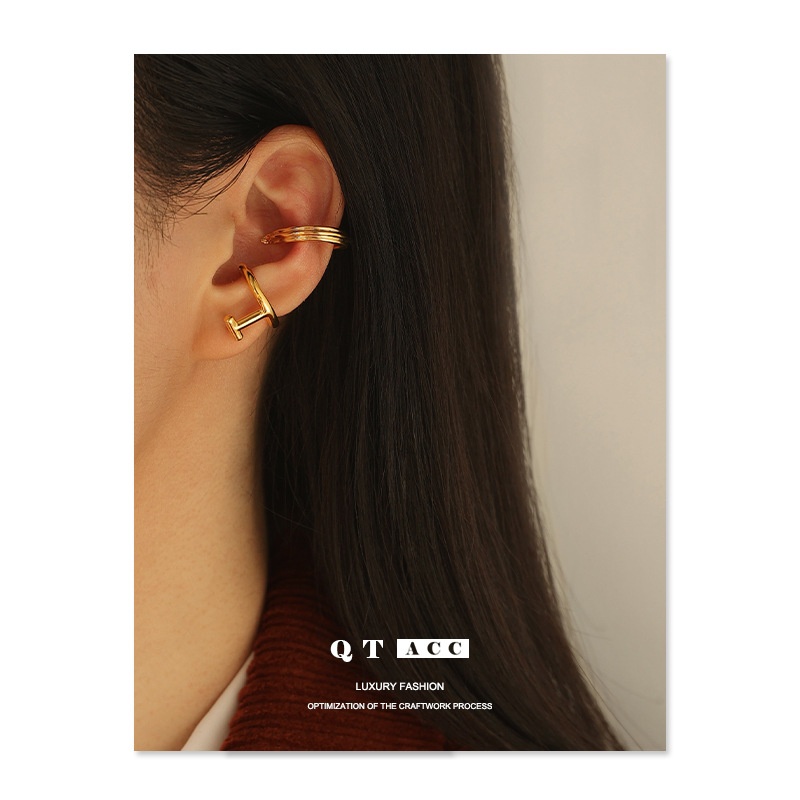 Latón chapado 18K oro real retro geométrico hueco diseño moda europea y americana temperamento earless pendientes clip de hueso del oído femenino