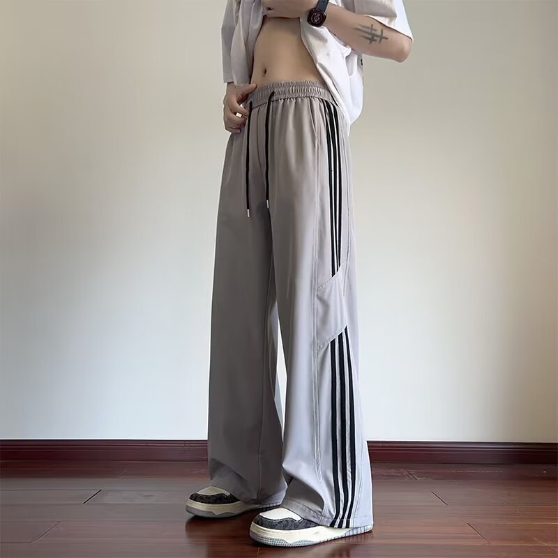 韓国風のシンプルなメンズサマーパンツ、多用途のルーズデザイン、ストレートワイドレッグパンツ、スポーツロングパンツ、ドロップシッピング