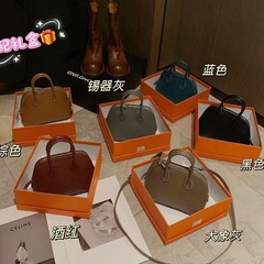 Miniボーリングの貝殻はワックスの線を包んで片肩を持って斜めに包んで高品質の手を持って小包を持ちます。