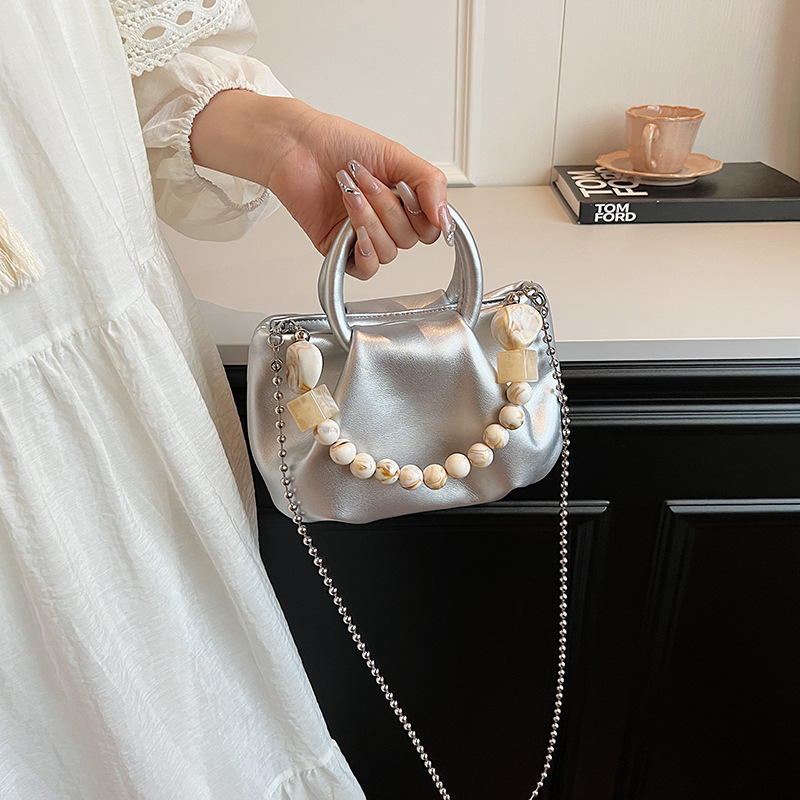 High end handbag for women in 2024, new niche design, summer handheld pleated chain strap, crossbody cloud bag_voghion.com