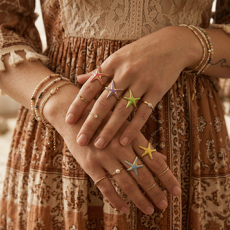 Tina Europa y los Estados Unidos transfronterizos lujo ligero anillo de estrella de mar nicho de diseño de goteo de aceite serie de joyas de mano para mujeres al por mayor