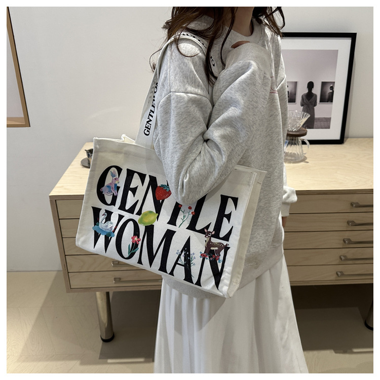Large-capacity letter canvas bag 2025 new style ins printed versatile shoulder bag for commuting and portable ladies' tote bag undefined