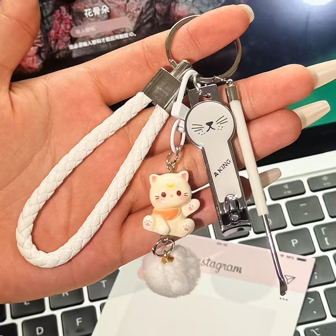 White leather rope + beige cat hair ball pendant + white cat face nail scissors …