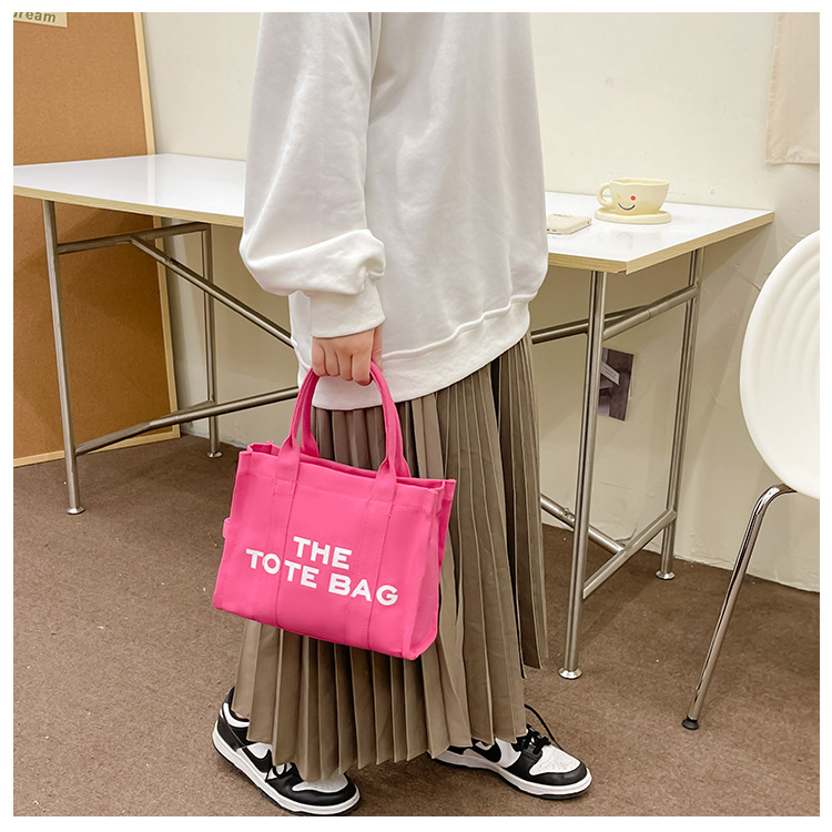Bolso de lona Hebei Baiou para mujer, de color sólido con estampado de letras, bolso bandolera de un solo hombro con estampado de letras.