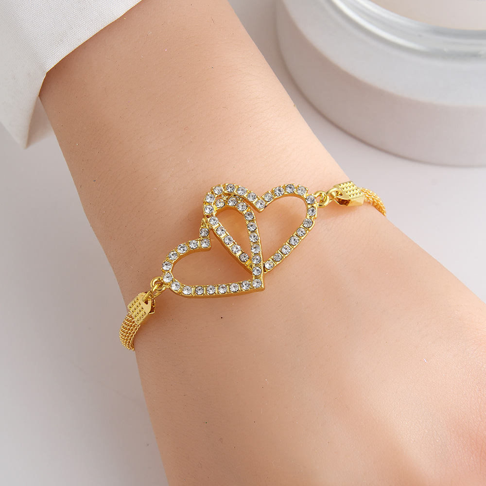 Neues europäisches und amerikanisches grenzüberschreitendes herzförmiges Armband mit Volldiamanten und doppelt ineinandergreifenden Herzen_voghion.com