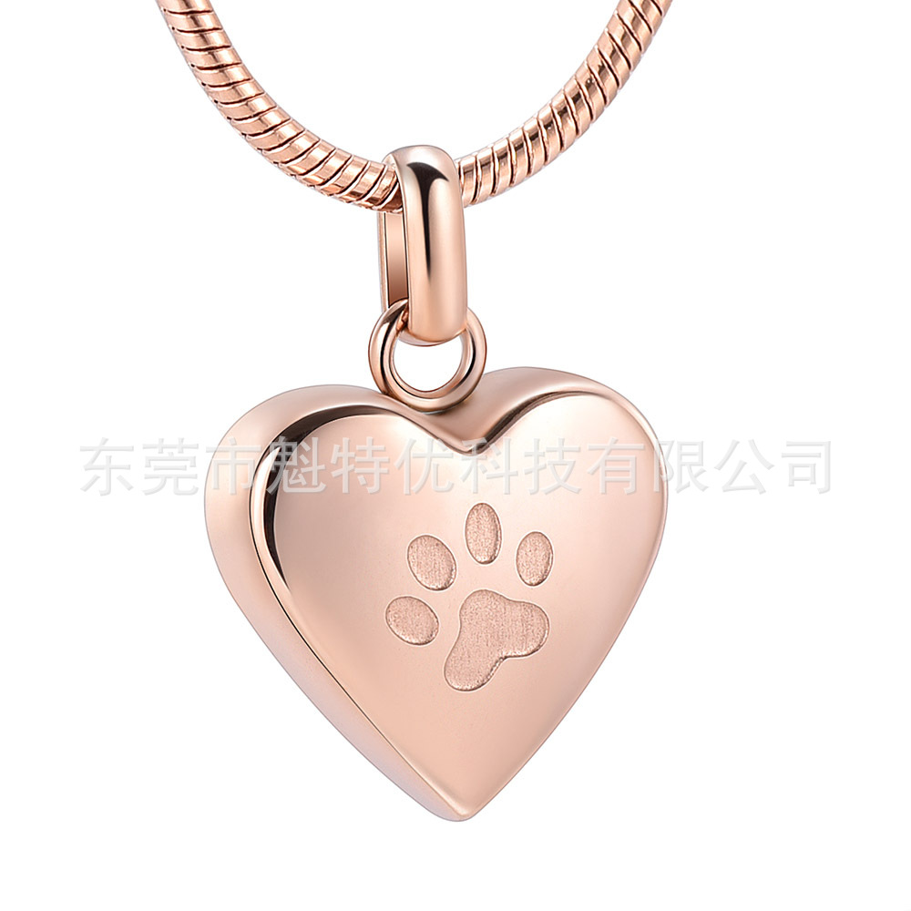 Japonés y coreano nuevo collar de acero de titanio de las mujeres no se desvanece en forma de corazón pata de impresión conmemorativa gato y perro mascota cinerario ataúd colgante impermeable