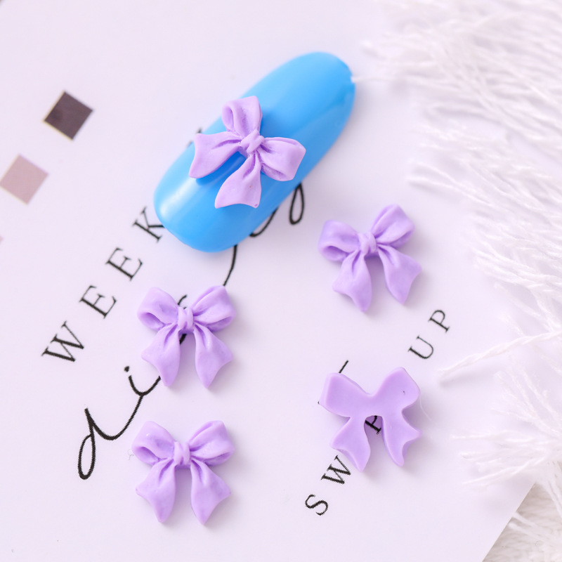 Mariposa de uñas popular repujado arco resina pajarita joyería simple todo partido tridimensional hueco decorativo diamante