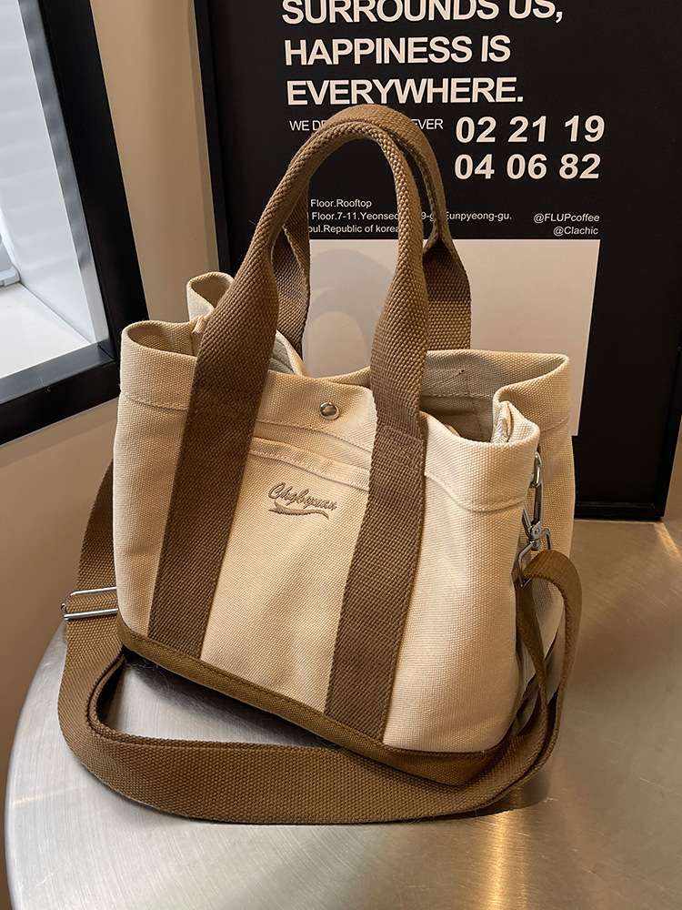 Bolso de hombro para mujer de nicho nuevo para otoño 2023, estilo coreano de internet, bolso de lona casual de mano, bandolera versátil para estudiantes