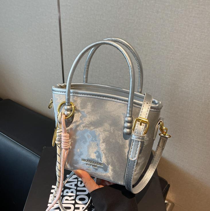 Comercio exterior venta caliente bolso de cubo de mano damas 2025 nuevo estilo de tendencia universal bolso de hombro de alta calidad bolso de moda