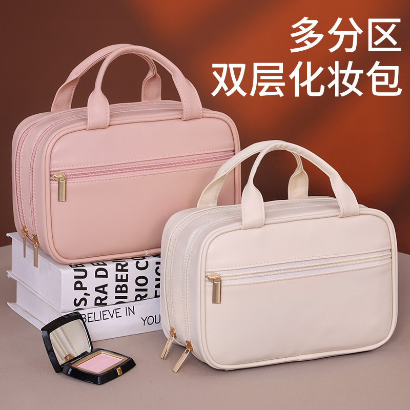 Bolsa de maquillaje portátil de doble capa francesa de gran capacidad de alto nivel de sensación de maquillaje bolsas de almacenamiento de cepillo de maquillaje bolsas de lavado de partición portátil de viaje
