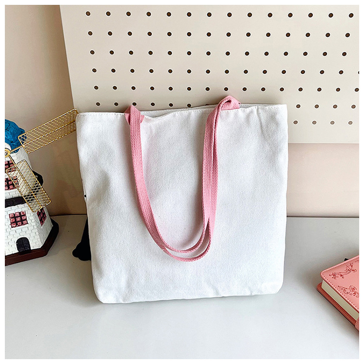 The new fashionable cartoon canvas bag, simple and versatile tote bag, cute commuting single-shoulder tote large bag, is selling well across borders undefined