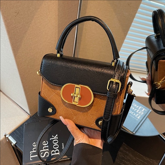 2025 otoño y invierno nuevo bolso de color contrastante bolso cuadrado pequeño de nicho de mujer empalmado bolso de hombro retro bolso de mochila
