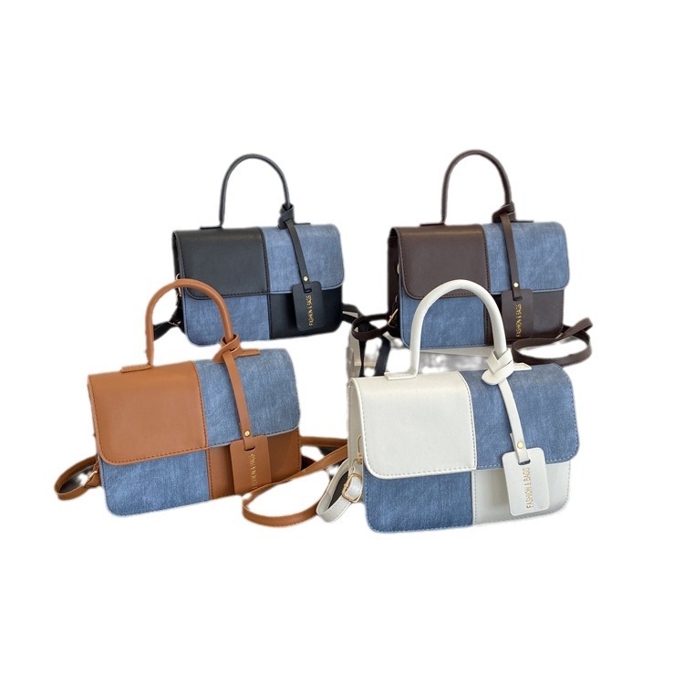 Nicho de diseño de color contrastante empalme bolso de mano 2025 nuevo mochila de textura bolso de hombro de moda