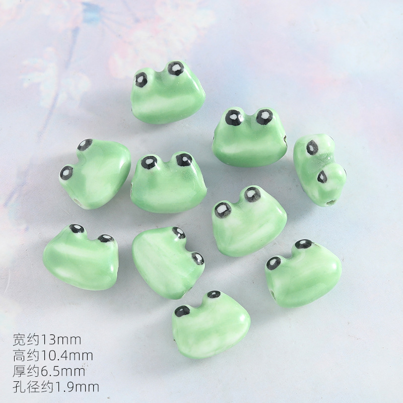 Hand-painted big-eyed frog (horizontal hole)