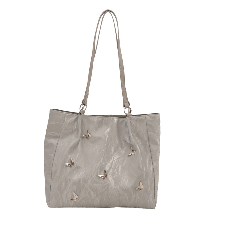 Bolsos de cubo de arco de alta calidad para mujeres 2024 verano nuevo estilo extranjero nicho bolso de hombro de moda bolso de mujer