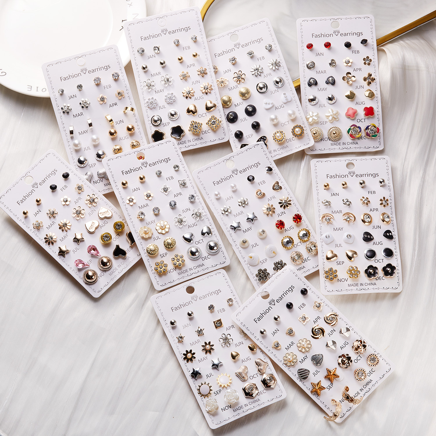 Set de aretes florales con perla y diamantes