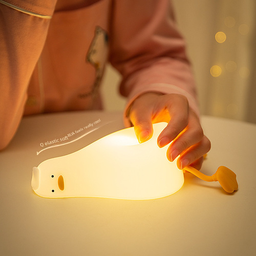 Flatlying Duck Small Night Light, Tap Tap Silicone LED Turning Duck Charging Bedside Companion Sleep Phone Stand Night Light Creative