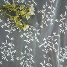 工厂定制涤纶材质网布刺绣面料满幅小花点点童装女装婚纱服装配饰