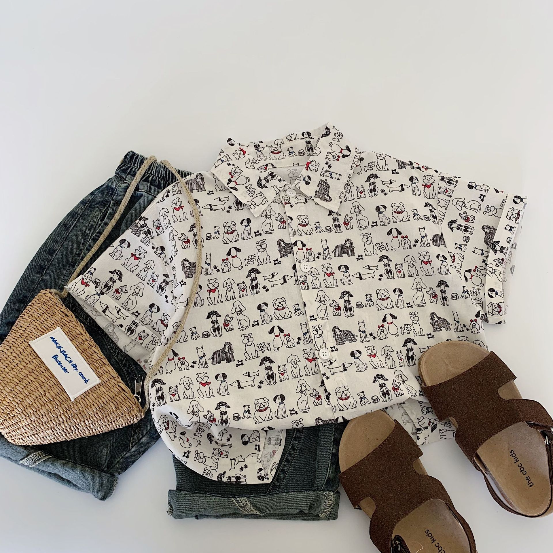 Camisa de manga corta para niños Maibao 2025 verano nuevo estilo coreano niño camisa de cachorro de impresión completa niño verano al por mayor