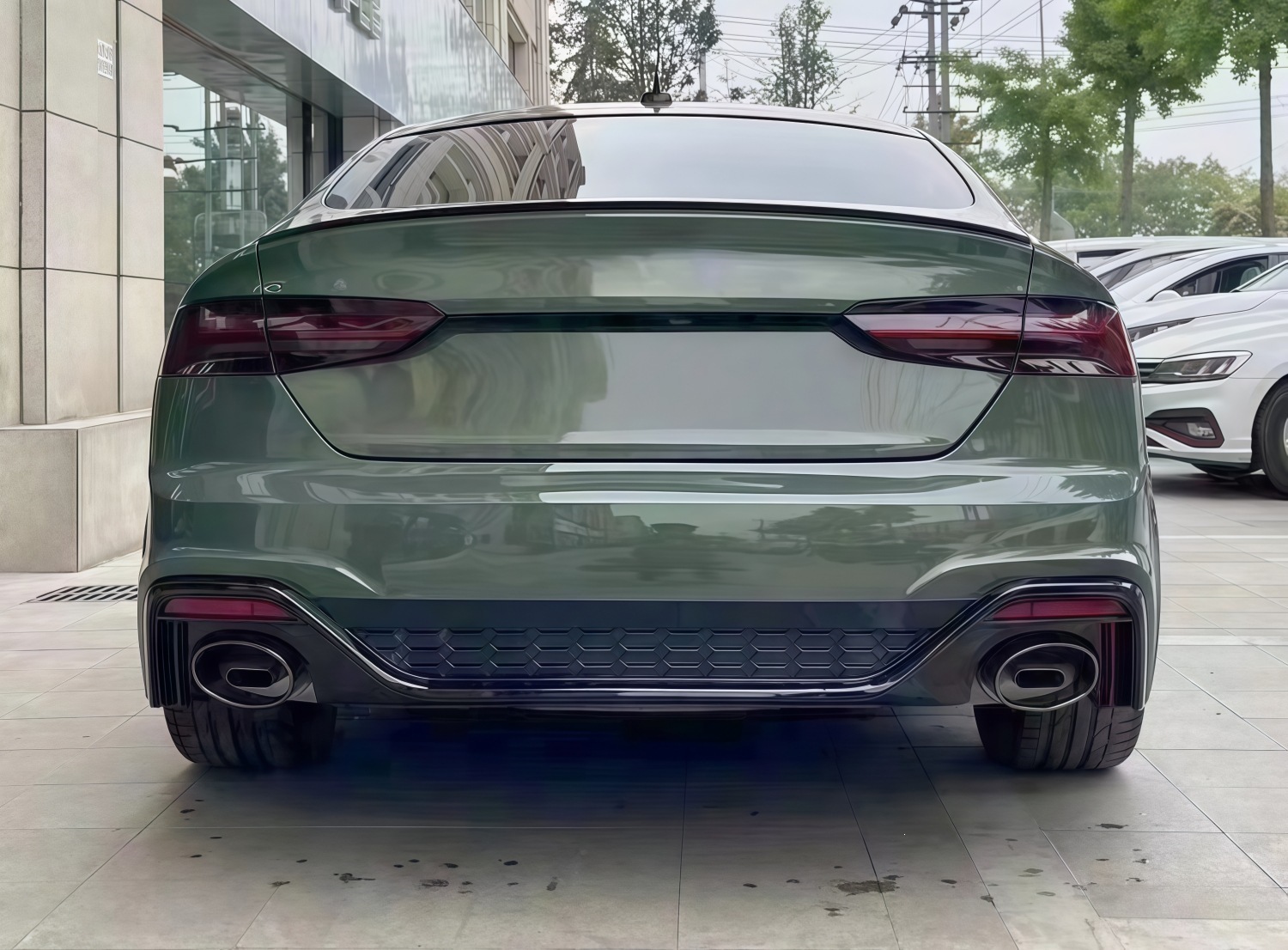 Suitable for Audi A5 2021-2024 models, RS5 rear bumper assembly, rear surround, tail lip, tail throat, and rear lower skirt, in a black finish