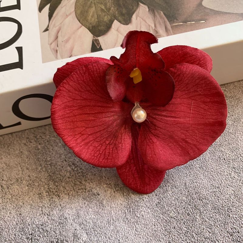 絹布の胡蝶蘭の花の頭は花の壁の部品の花の材料の頭をシミュレーションして髪を飾ってdiyの手作りの結婚祝いの贈り物を挟んで造花を飾ります。|undefined