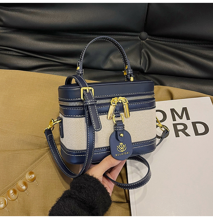 Bolso de mano de alta sensación para mujeres 2025, nueva moda transfronteriza, bolso de caja de empalme de color, bolso casual, bolso cuadrado simple