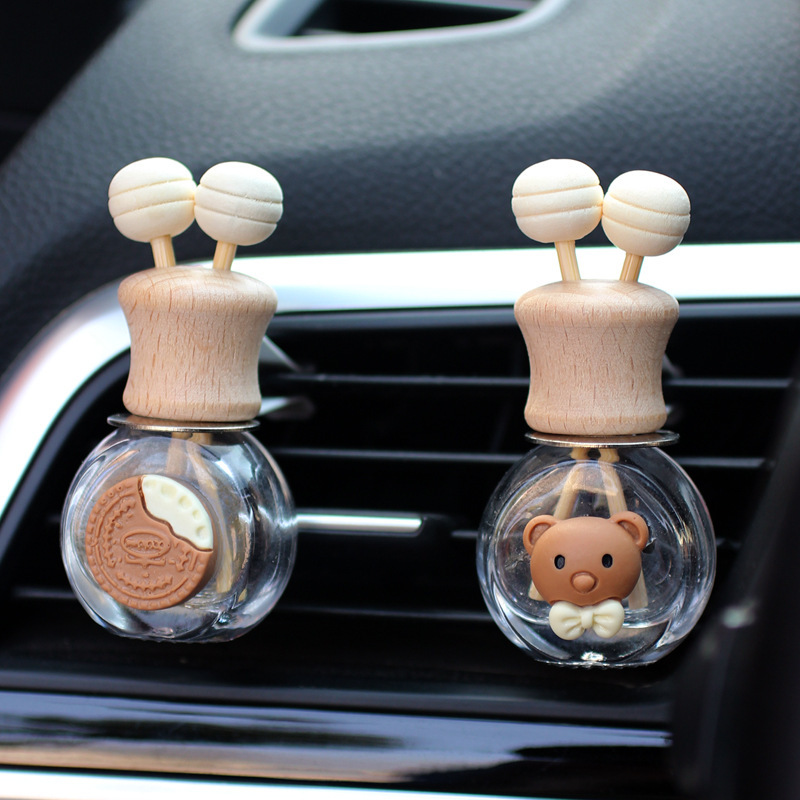 Salida de aire de perfume de coche, dibujos animados, celebridad de Internet, botella de aromaterapia de coche, clip de aire acondicionado, accesorios de coche, bowknot tembloroso