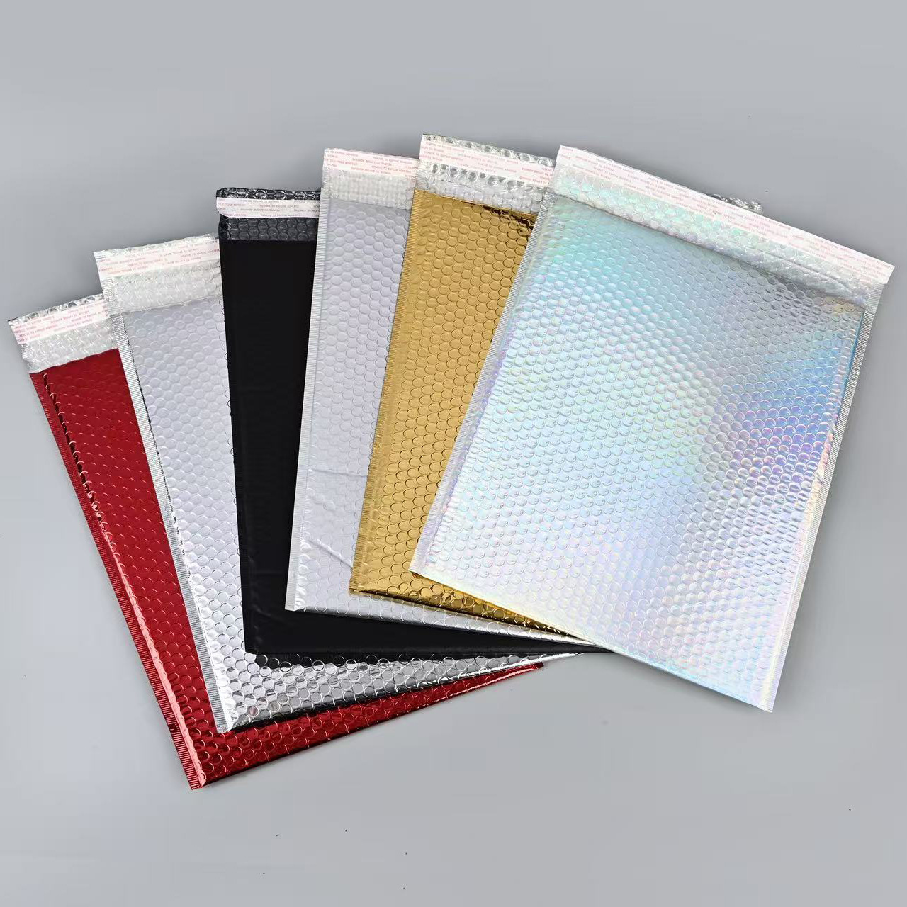 Bolso expreso de espuma de película de aluminio engrosado bolso de burbuja a prueba de golpes de color al por mayor bolsa de embalaje de ropa fabricante de bolsa de espuma engrosada