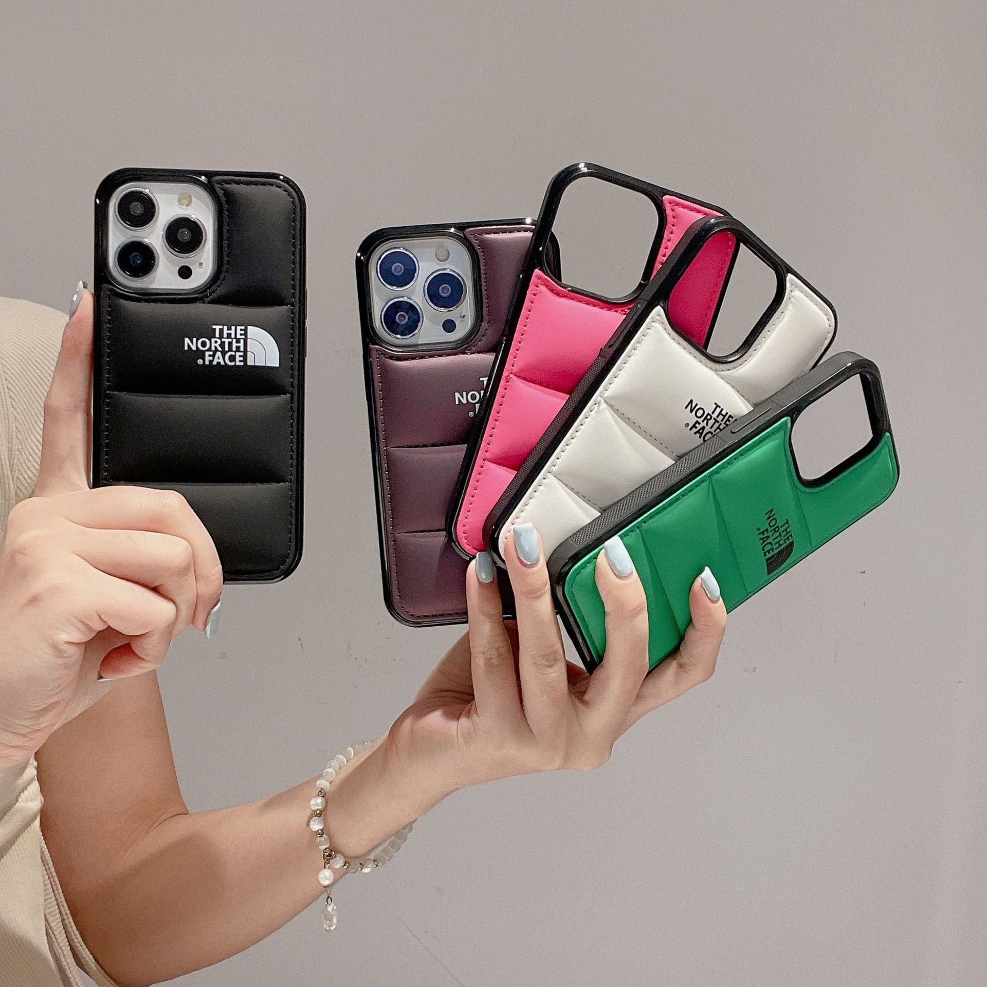 Chaqueta de plumón en el lado norte para iPhone16promax funda de teléfono de algodón relleno 14promax chaqueta de plumón rellena de algodón 13