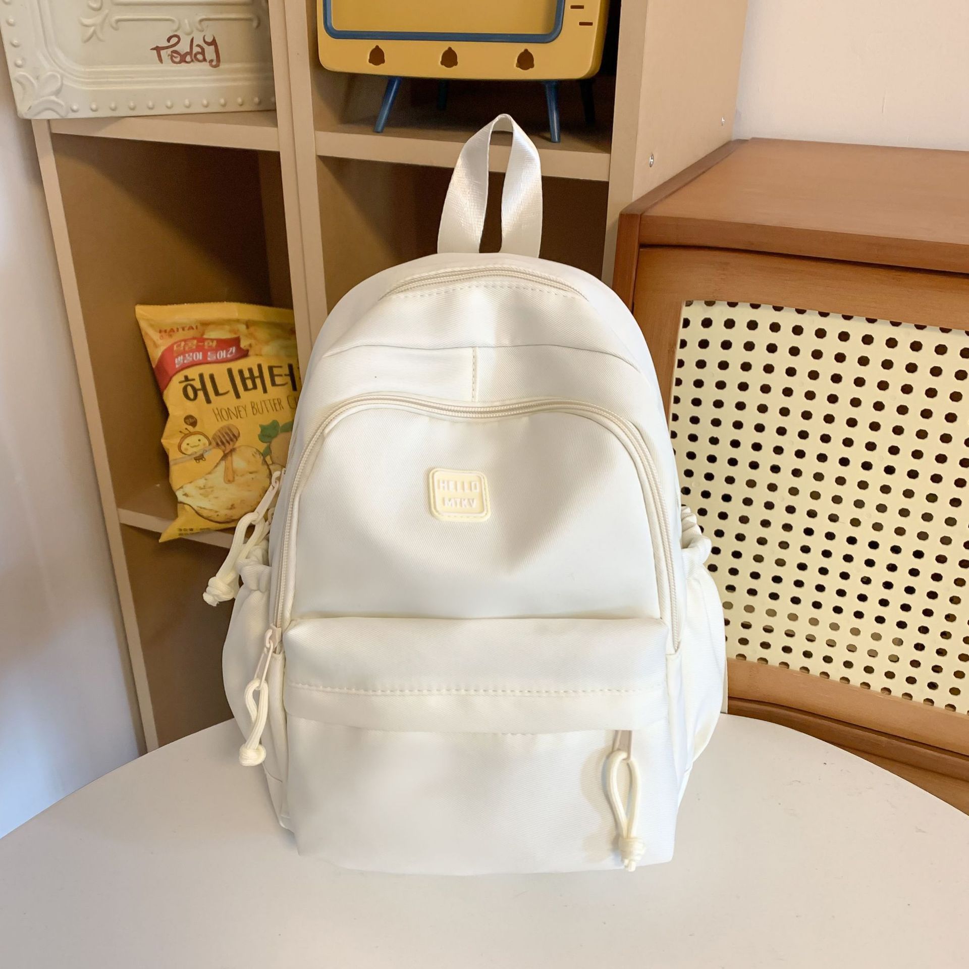 La nueva mochila simple y versátil de gran capacidad Mori es una mochila de estilo universitario pequeña y fresca, bolsa de computadora de viaje