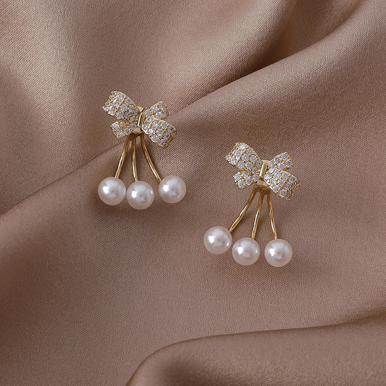 الجملة بسيطة مايكرو مطعمة الزركون Bowknot اللؤلؤ النحاس أقراط Nihaojewelry display picture 4